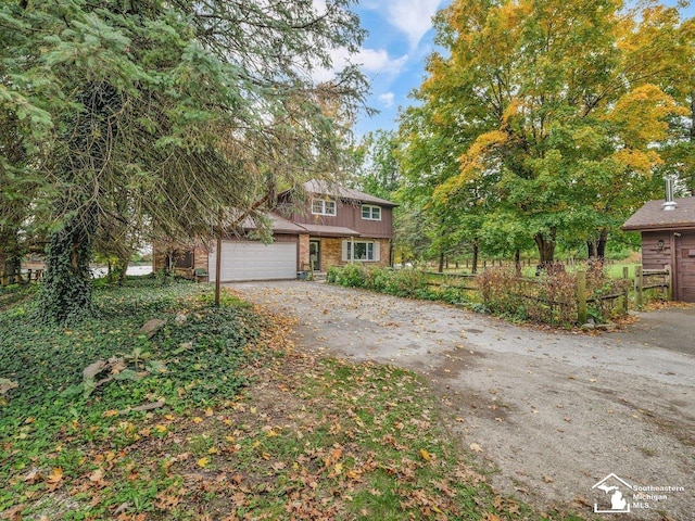 6405 Stillwater Ct, Erie, MI 48133 - view of front of house featuring driveway, a garage, and brick siding