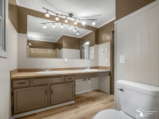 6405 Stillwater Ct, Erie, MI 48133 - bathroom with toilet, wood finished floors, and double vanity