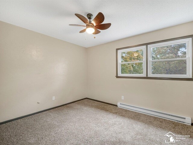 6405 Stillwater Ct, Erie, MI 48133 - carpeted empty room with baseboard heating, ceiling fan, and baseboards