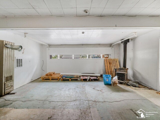 6405 Stillwater Ct, Erie, MI 48133 - garage with a wood stove