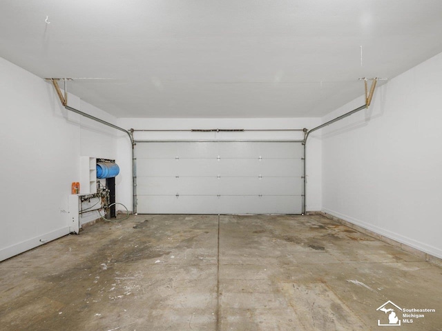 6405 Stillwater Ct, Erie, MI 48133 - garage featuring baseboards