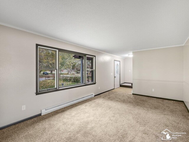 6405 Stillwater Ct, Erie, MI 48133 - empty room featuring a baseboard heating unit, carpet flooring, crown molding, baseboards, and a textured ceiling