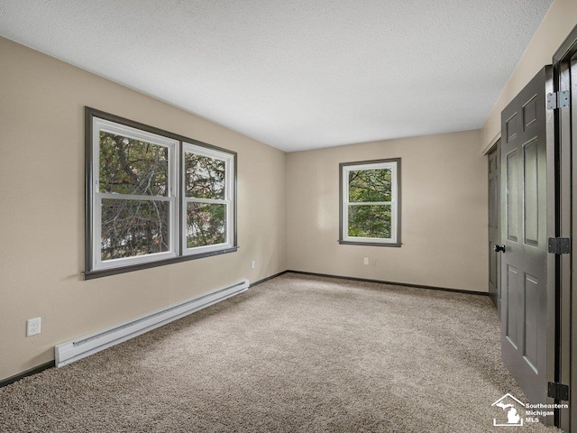 6405 Stillwater Ct, Erie, MI 48133 - unfurnished bedroom featuring baseboard heating, carpet flooring, baseboards, and a textured ceiling