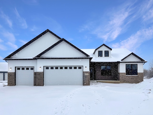 modern farmhouse style home featuring a garage