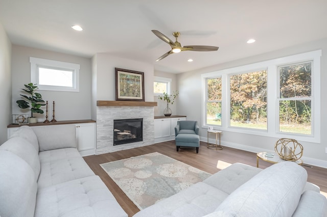 2680 Ashford Trl, Portage, MI 49024 - living room with a tile fireplace, ceiling fan, wood finished floors, recessed lighting, and baseboards