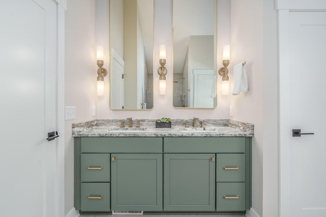 2680 Ashford Trl, Portage, MI 49024 - full bathroom with double vanity, baseboards, and a shower