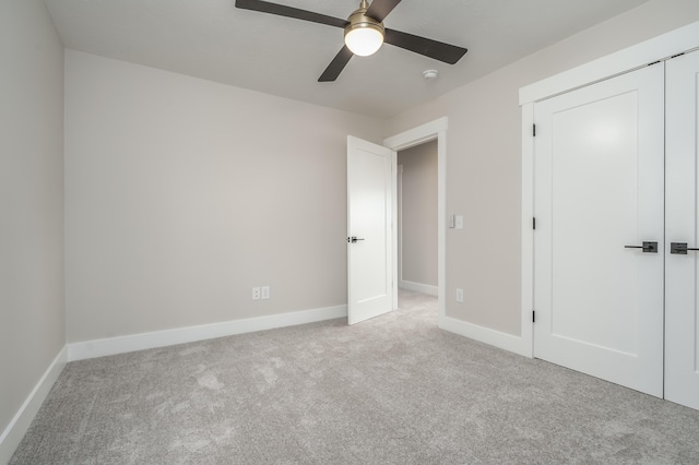 2680 Ashford Trl, Portage, MI 49024 - unfurnished bedroom featuring carpet, a closet, baseboards, and a ceiling fan