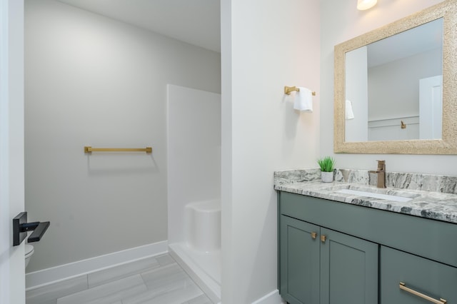 2680 Ashford Trl, Portage, MI 49024 - full bath featuring vanity, baseboards, toilet, and a shower