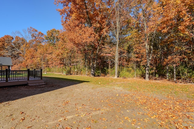 2680 Ashford Trl, Portage, MI 49024 - view of yard featuring a wooden deck and a forest view