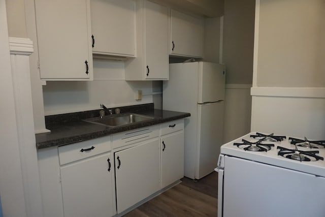 kitchen featuring white cabinets, dark wood-type flooring, sink, and white appliances