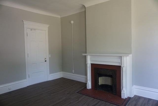 unfurnished living room featuring dark wood-type flooring