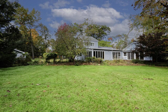 17388 Arbor Ln, New Buffalo, MI 49117 - view of grassy yard featuring a sunroom
