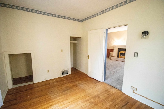 unfurnished room featuring hardwood / wood-style flooring