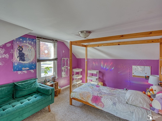 carpeted bedroom featuring lofted ceiling