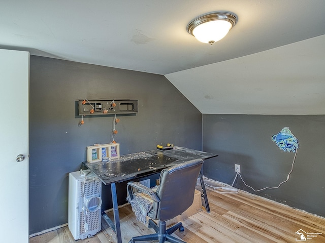 office area featuring wood-type flooring and lofted ceiling