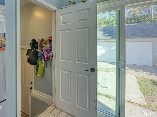 entryway with light tile patterned floors