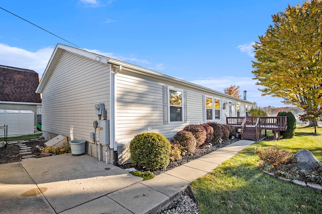 view of property exterior with a deck