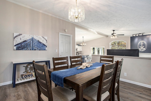 dining room with vaulted ceiling, a textured ceiling, dark wood-type flooring, and ceiling fan with notable chandelier