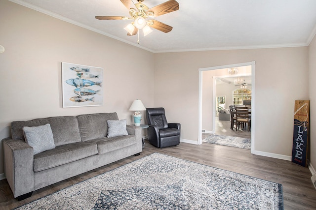 living room with hardwood / wood-style flooring, ceiling fan, and ornamental molding