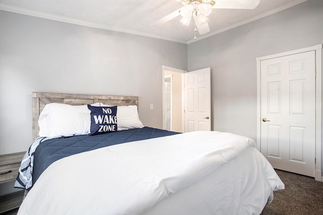 bedroom with ceiling fan, dark carpet, and ornamental molding