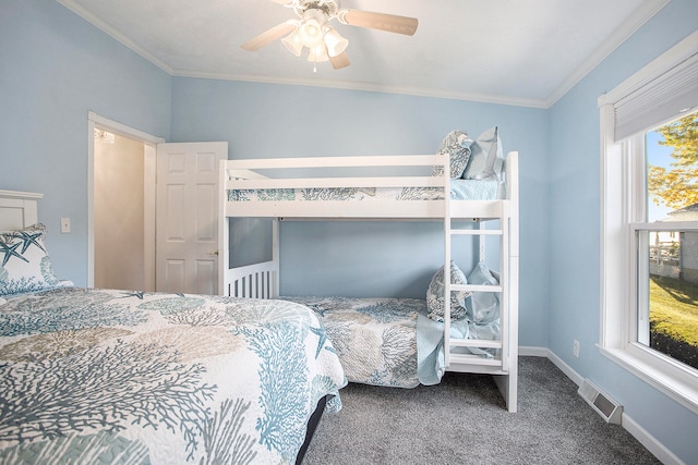 carpeted bedroom featuring ceiling fan and ornamental molding