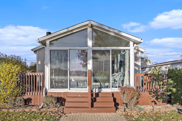 rear view of house with a sunroom