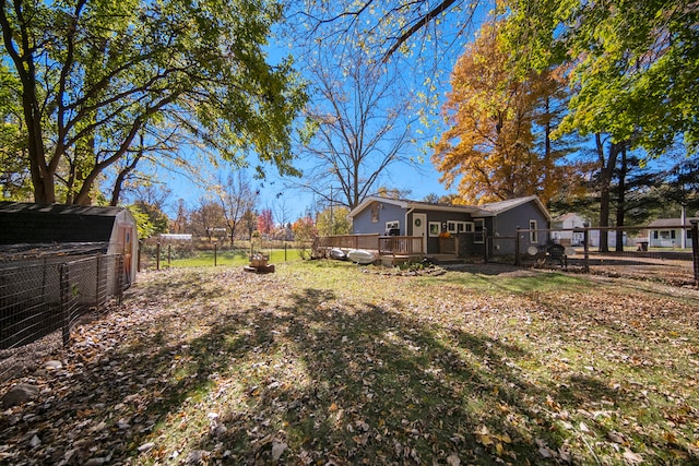 view of yard with a wooden deck