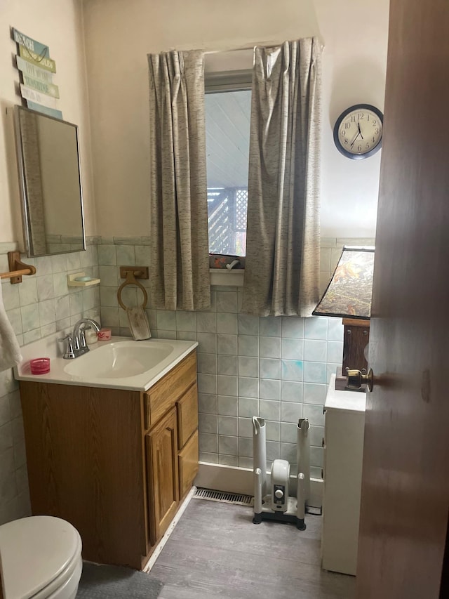 bathroom featuring hardwood / wood-style flooring, vanity, and toilet