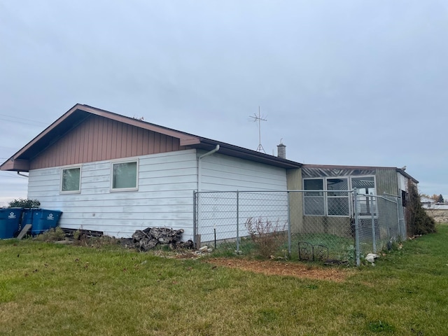 view of property exterior featuring a yard