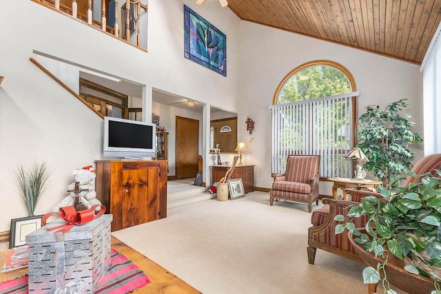 living room featuring hardwood / wood-style floors, wooden ceiling, vaulted ceiling, and ornamental molding