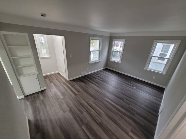 interior space with dark hardwood / wood-style floors