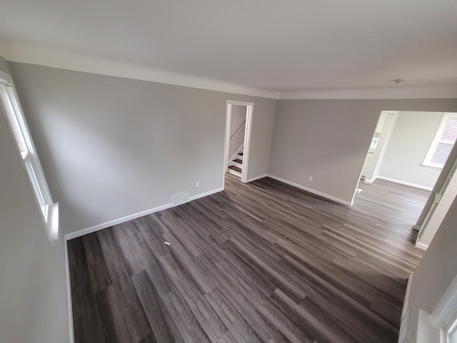 spare room featuring dark hardwood / wood-style flooring