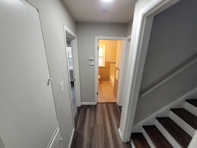 corridor with dark wood-type flooring