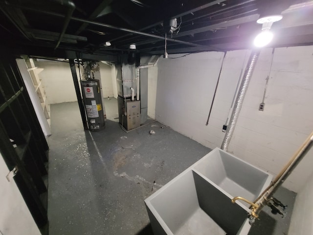 basement featuring sink, heating unit, and water heater