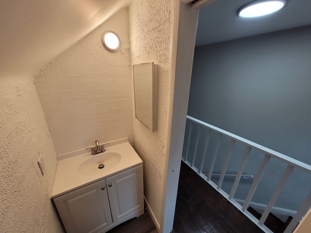 bathroom featuring vanity and wood-type flooring