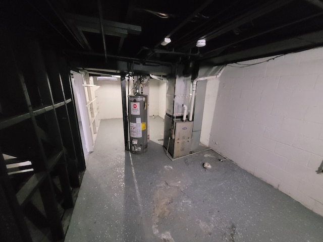 basement featuring heating unit and water heater