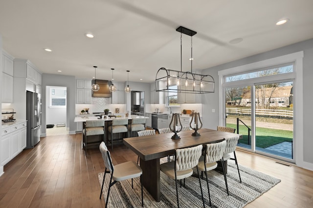 dining space featuring hardwood / wood-style flooring