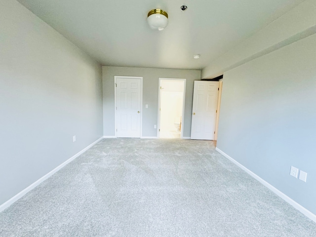 unfurnished bedroom with carpet flooring