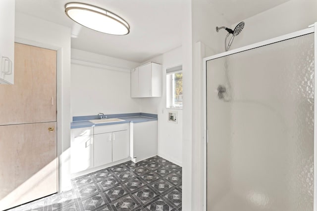 bathroom featuring vanity and an enclosed shower