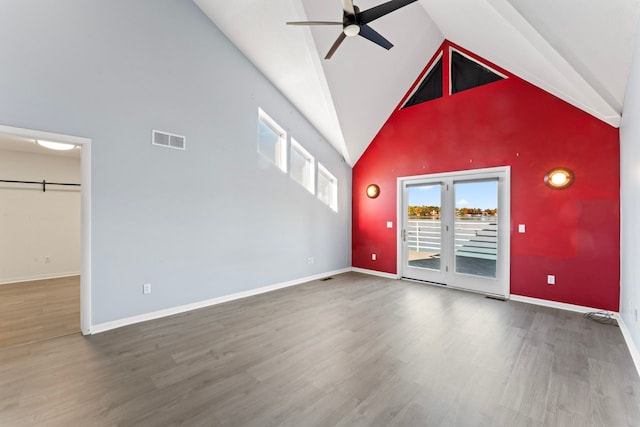 unfurnished room featuring ceiling fan, high vaulted ceiling, and hardwood / wood-style flooring