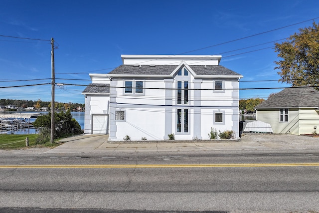 view of front of property with a water view