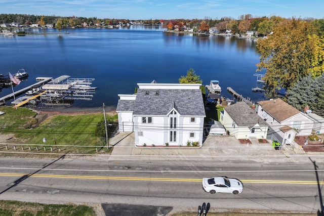 birds eye view of property with a water view