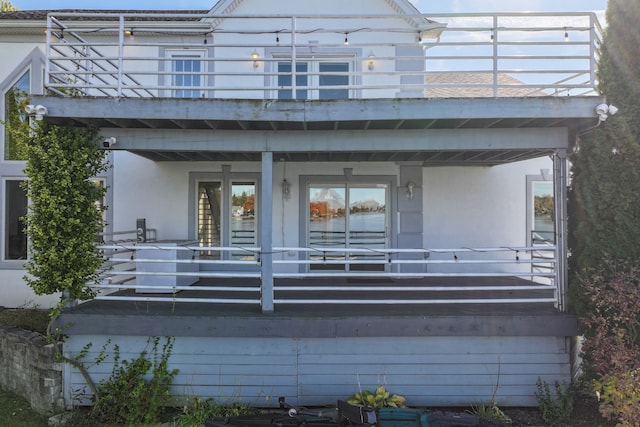 rear view of house with a balcony