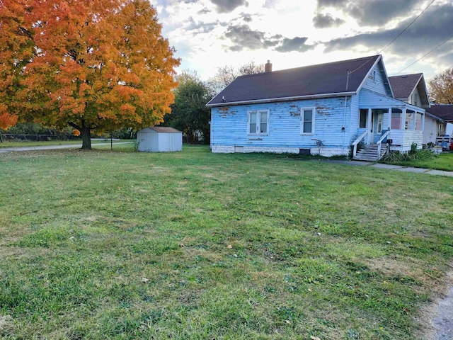 view of property exterior featuring a shed and a yard