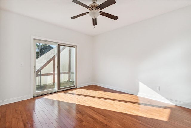 empty room featuring hardwood / wood-style flooring and ceiling fan