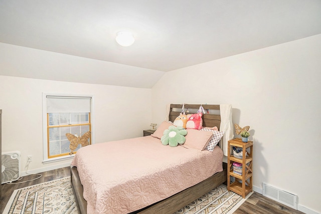 bedroom featuring lofted ceiling and wood-type flooring