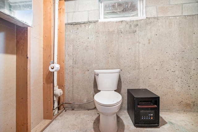 bathroom with toilet and concrete floors