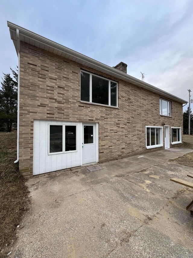 back of property with a patio area