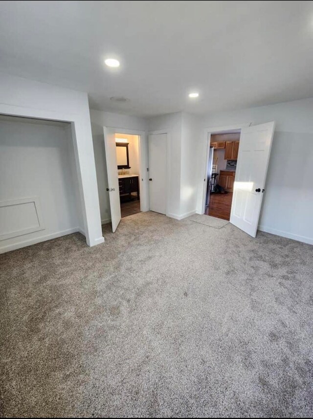 unfurnished living room with carpet floors