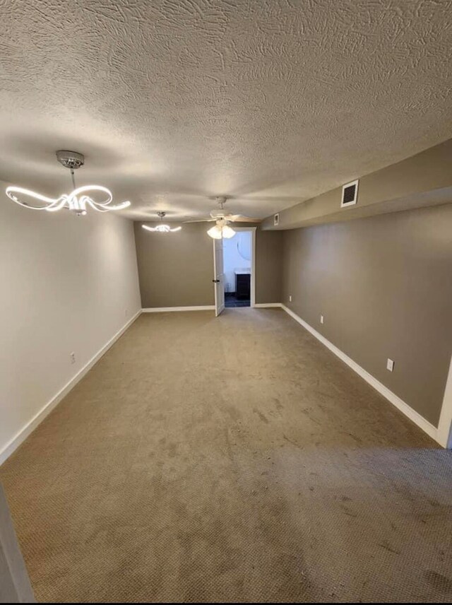 interior space with carpet and a textured ceiling